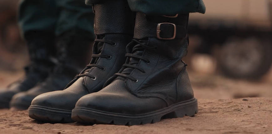 Close up of wildlife ranger boots, standing to attention.